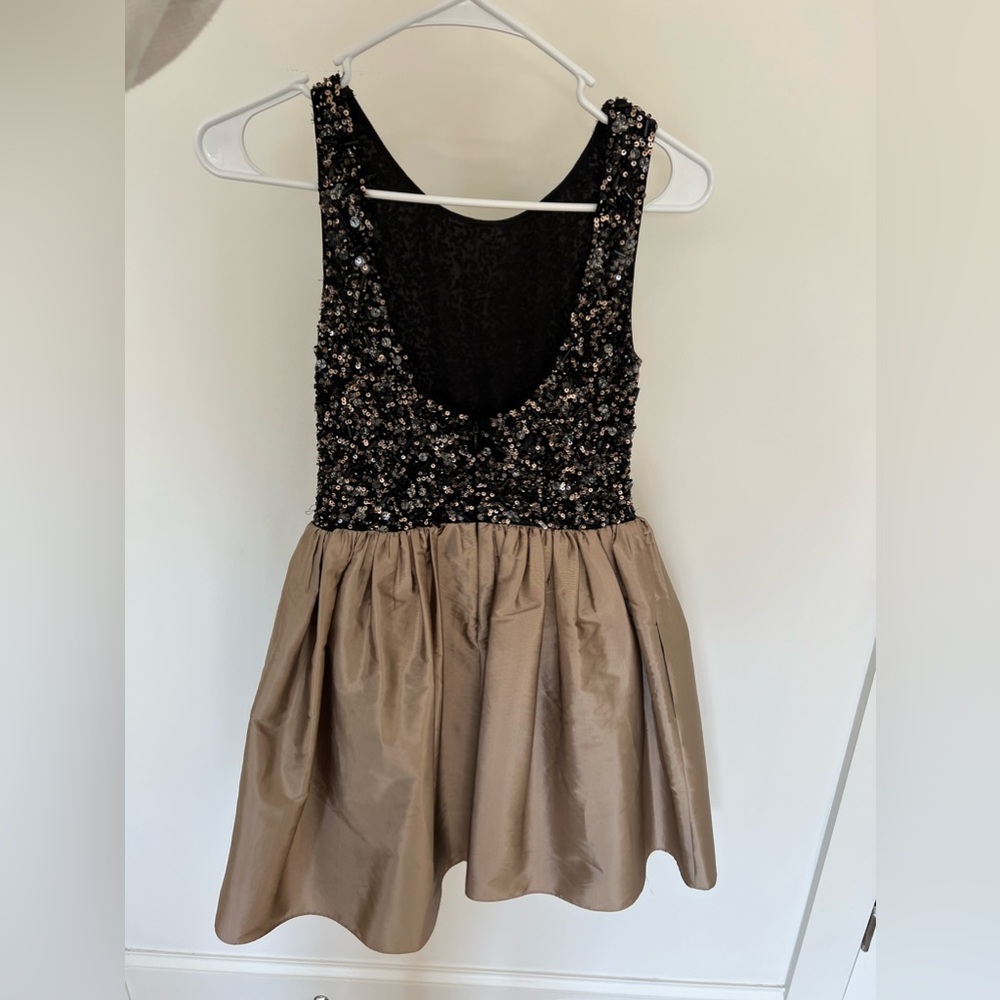 Gorgeous cocktail dress. Black bodice with intricate beading and gold skirt.